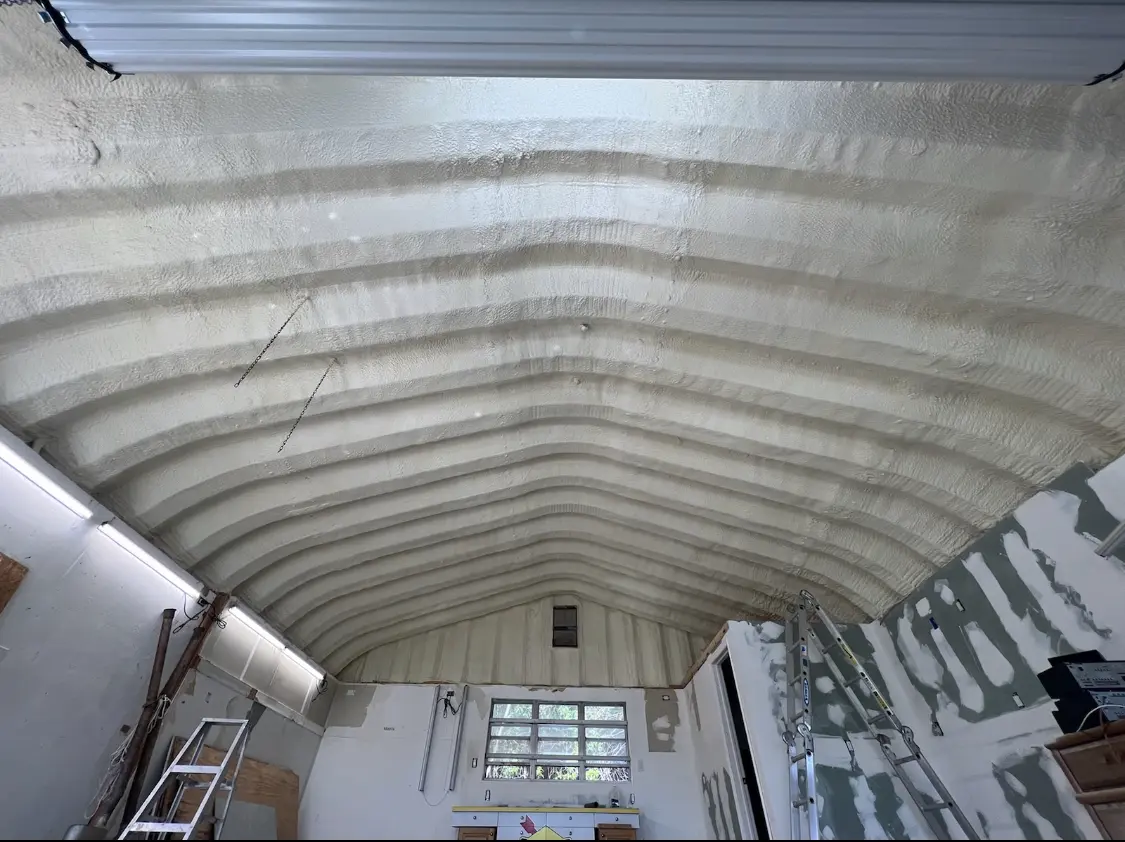 Spray polyurethane foam applied to the underside of a metal roof deck in Lincolnwood